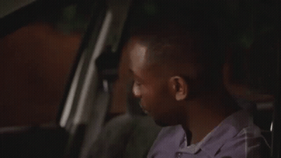 Man Sitting In Car Looking Out Window GIF