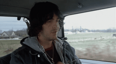 Man Sitting In Car Smoking GIF