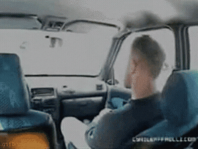Man Sitting In Car Talking On Phone GIF