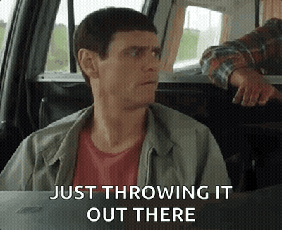 Man Sitting in Car Throwing Something Out Window