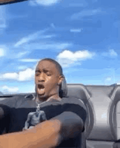 Man Sitting In Car With Mouth Open Blue Sky GIF