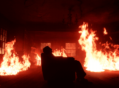 Man Sitting In Chair Before Flames GIF