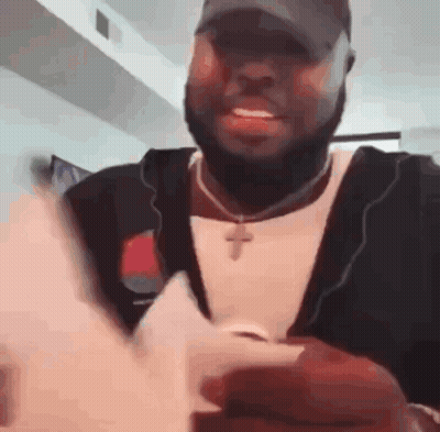 Man Sitting In Chair By Avengers Poster GIF
