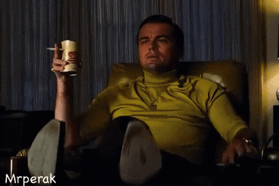 Man Sitting In Chair Holding Beer And Pointing GIF