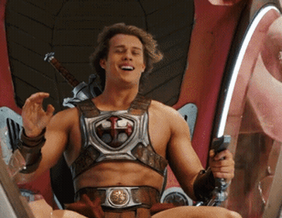 Man Sitting In Chair Holding Sword And Shield GIF