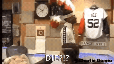 Man Sitting In Chair In Front Of Clock And Jersey Saying Die GIF