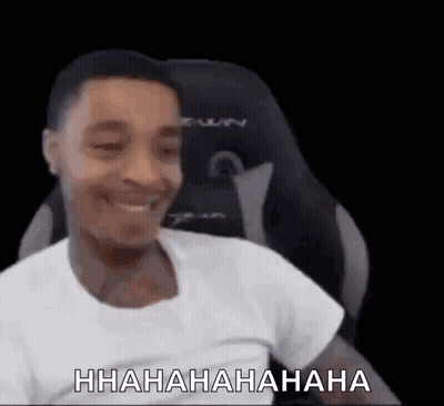 Man Sitting In Chair Laughing GIF