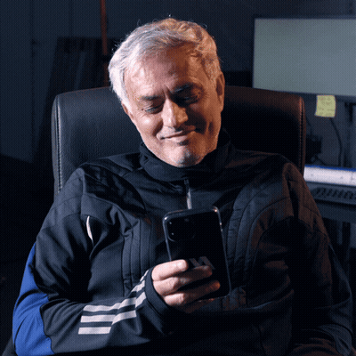 Man Sitting In Chair Looking At Phone GIF