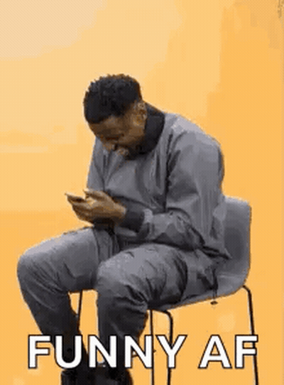 Man Sitting In Chair Looking At Phone Saying Funny AF GIF