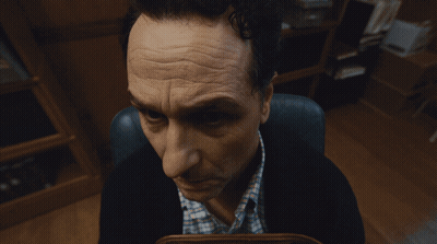 Man Sitting In Chair Looking GIF
