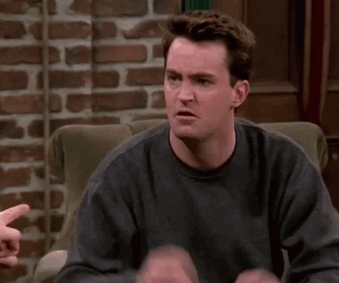 Man Sitting In Chair Making Funny Face GIF