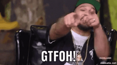 Man Sitting In Chair Making Funny Face Pointing At Camera GIF