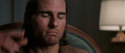 Man Sitting In Chair Next To Lamp Eyes Closed GIF