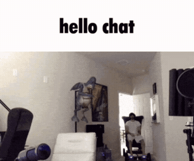 Man Sitting In Chair Saying Hello Chat GIF