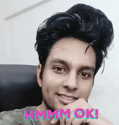 Man Sitting In Chair Saying Hmm Ok GIF