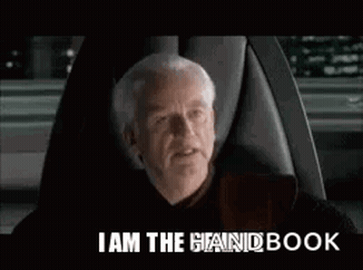 Man Sitting In Chair Saying I Am The Handbook GIF