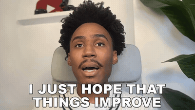 Man Sitting In Chair Saying I Just Hope That Things Improve GIF