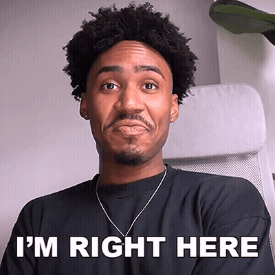 Man Sitting In Chair Saying I'm Right Here GIF