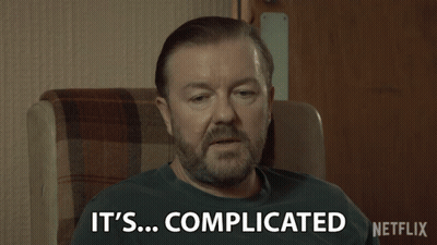 Man Sitting In Chair Saying It's Complicated GIF