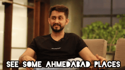 Man Sitting in Chair Saying See Some Ahmedabad Places