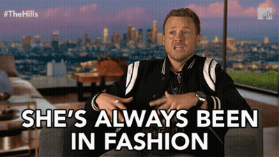 Man Sitting In Chair Saying She's Always Been In Fashion GIF