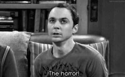 Man Sitting In Chair Saying The Horror GIF