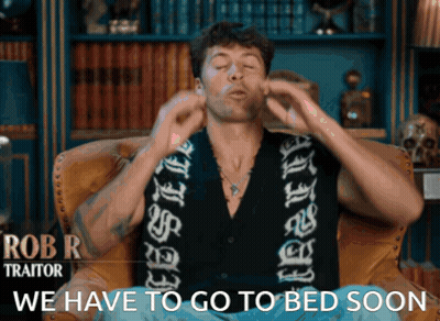 Man Sitting In Chair Saying We Have To Go To Bed Soon GIF