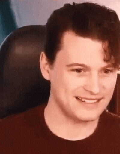Man Sitting In Chair Smiling GIF