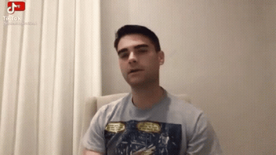 Man Sitting In Chair Talking On Video Call GIF