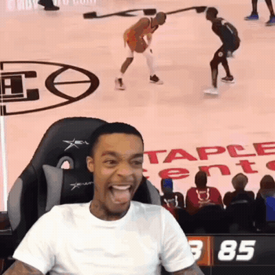 Man Sitting In Chair Watching Basketball Game With Number 85 GIF
