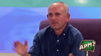 Man Sitting In Chair With APM Sign GIF