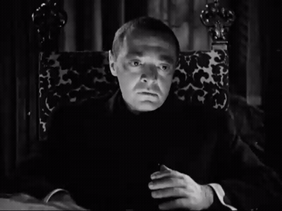 Man Sitting In Chair With Hands Folded GIF