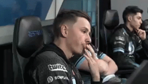 Man Sitting In Chair With Hands On Face GIF