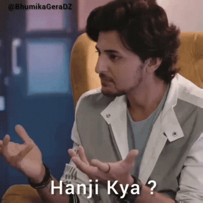 Man Sitting In Chair With Hands Out Saying Hanj Kya GIF