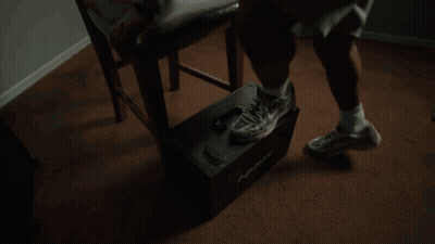 Man Sitting In Chair With Legs Crossed GIF