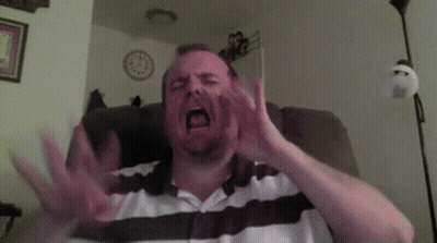 Man Sitting In Chair With Mouth Open GIF