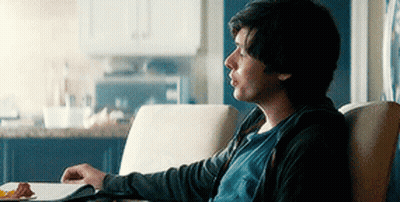 Man Sitting In Chair With Plate Of Food GIF