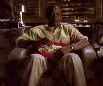 Man Sitting In Chair With Popcorn GIF