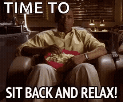 Man Sitting In Chair With Popcorn GIF