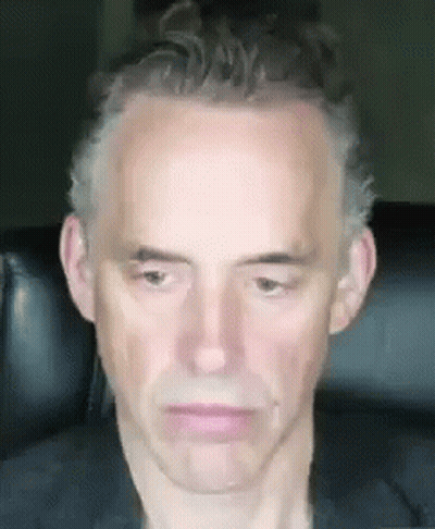 Man Sitting In Chair With Serious Look GIF