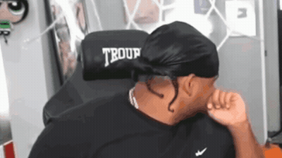 Man Sitting In Chair With Word Troup GIF