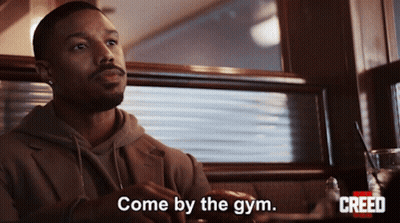 Man Sitting In Diner With Come By The Gym GIF