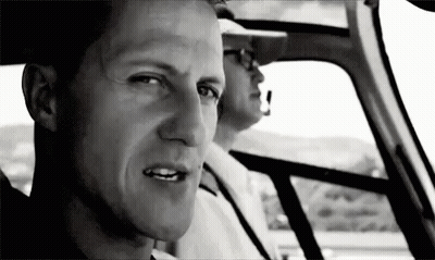 Man Sitting In Driver's Seat Looking Out Window GIF