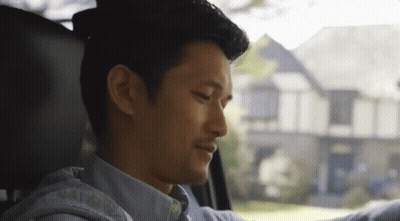 Man Sitting In Driver's Seat Looking Out Window GIF