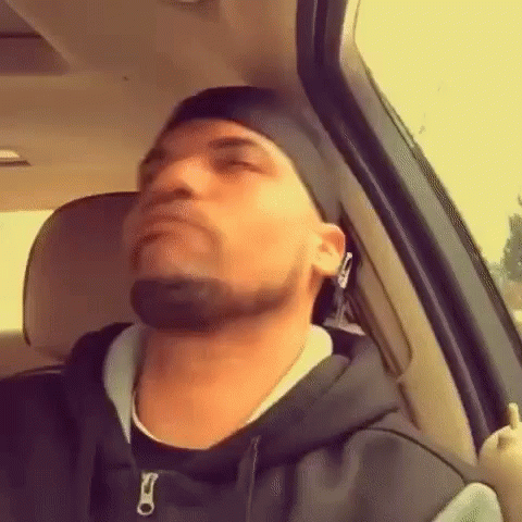 Man Sitting In Driver's Seat Of Car With Eyes Closed GIF