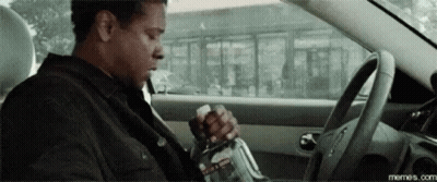 Man Sitting In Driver Seat Holding Bottle GIF