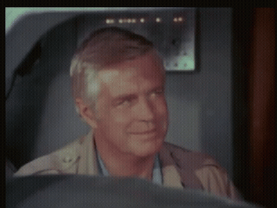 Man Sitting In Front Of Airplane With Letter G GIF
