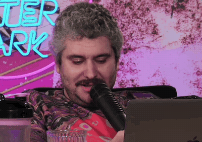 Man Sitting In Front Of Better Ark Sign GIF