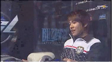 Man Sitting In Front Of Blizzard Logo GIF