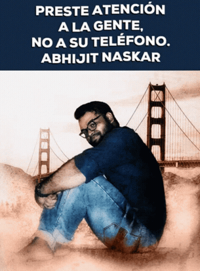 Man Sitting In Front Of Bridge Preste Atencion A La Gente GIF